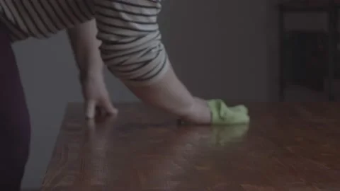 The woman washes the table. View in the frame of the hands and the surface of th Video stock 233030513