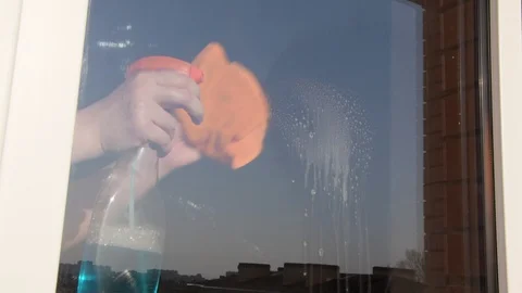 A woman washes a window. Stock Footage 128523596