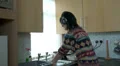Woman washing up, dancing to music HD Footage