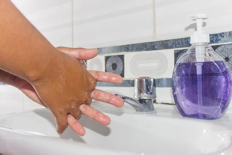 Woman washing hands Stock Photos
