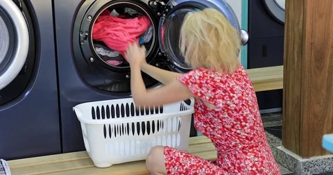 Woman washing machine Stock Footage