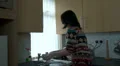Woman washing up quickly and talking HD Footage