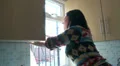 Woman washing window HD Footage