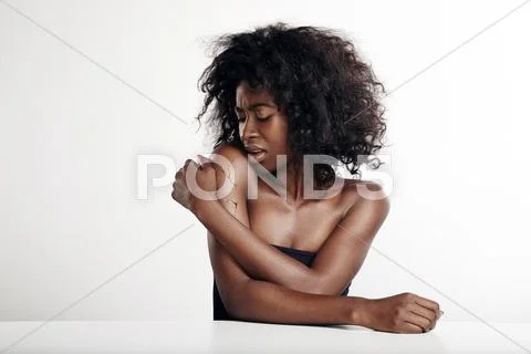 Woman watching at her shoulder with a cracked skin Stock Photos