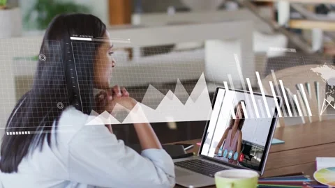 Woman watching laptop while peer sharing data, graphs morphing into world map Stock Footage 333494572