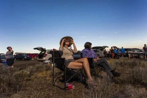Woman watching solar eclipse, August 8, 2017, Maupin, Oregon, USA Stock Photos