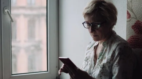 Woman watching something on the smartphone screen 動画素材 74024155