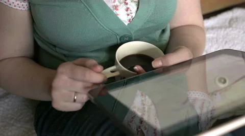 Woman in watching something on tablet computer Video stock 62546454