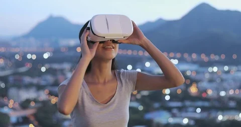 Woman watching with virtual reality in city Stock Footage