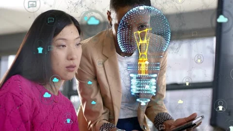 Woman watching while man using tablet, causing 3D bulb hologram and cloud icons, Stock Footage 333594507