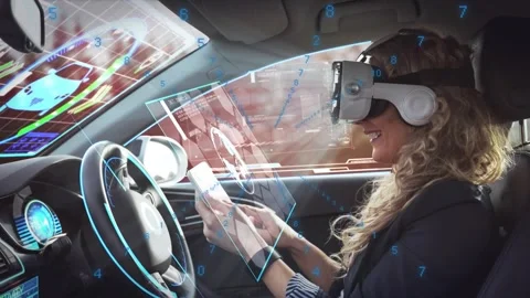 Woman wearing AR visor using phone, shifting HUD panels over windshield for Stock Footage 329751889