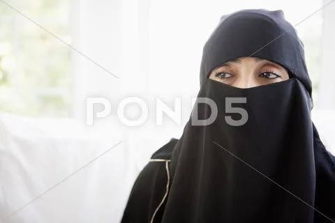 Woman wearing black veil indoors (high key) Stock Photos