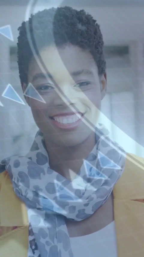 Woman wearing blazer with triangular overlay drifting across face, smiling for Stock Footage 334547485