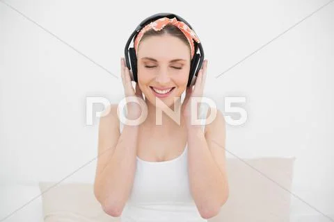 Woman wearing headphones with closed eyes Stock Photos