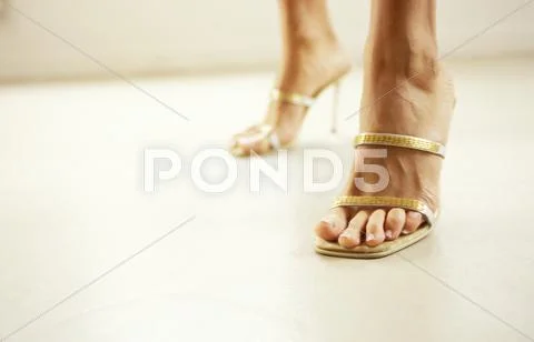 Woman Wearing High Heels, Cropped View Of Feet
