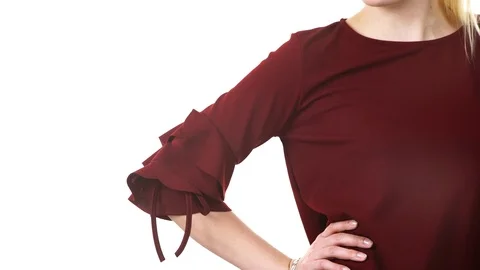 Woman wearing ruby ruffle tied sleeve top Stock Footage 82845652