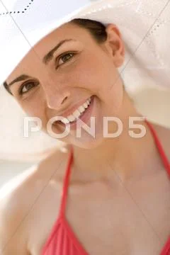 Woman wearing a sunhat Stock Photos