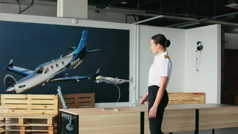 Woman wearing uniform working as pilot instructor. Stock Footage 234389605