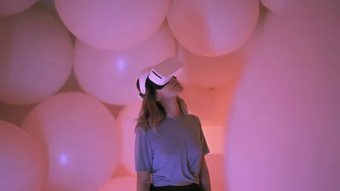 Woman wearing VR headset inside virtual reality world, abstract 3d space Stock Footage 208860005