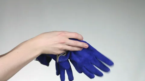 Woman wears two gloves on hands. Stock Footage 60404553