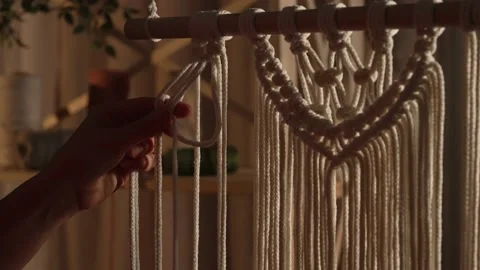 Woman weaves pattern of macrame threads with her own hands for decoration or Stock Footage 172237806