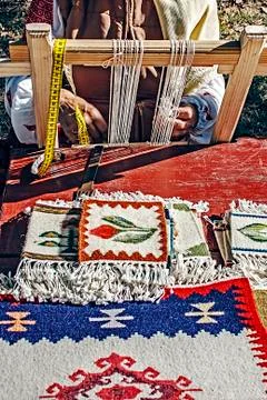 Woman weaves Stock Photos