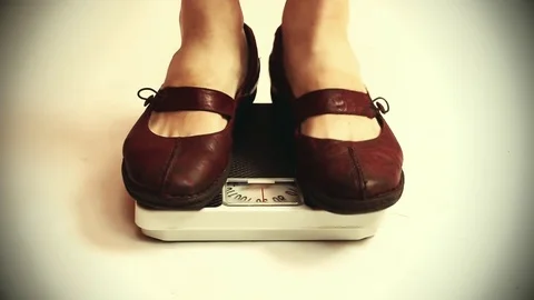 Woman on a weight. Stock Footage 73104038