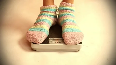 Woman on a weight. Video stock 73104052
