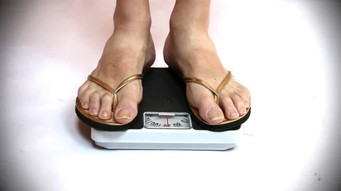 Woman on a weight. Stock Footage 73104101