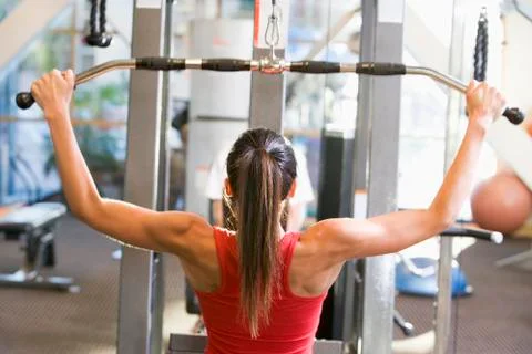 Woman weight training at gym Stock Photos