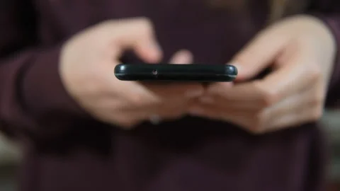 Woman while use smartphone for chat and web browsing,social technology addiction Stock Footage 231545086