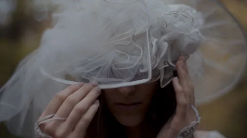 Woman white Hat While she is Looking At Camera Stock Footage 258285870