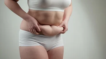 Woman in white underwear holds her fat b, Stock Video