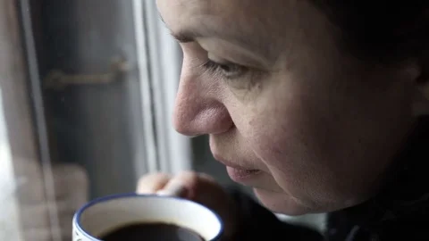 Woman at Window Drinking Coffee Handheld Stock Footage 72622459