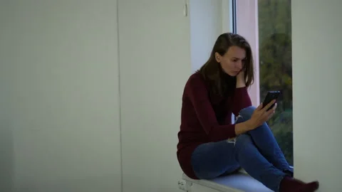 Woman on the window upset. Stock Footage 142132659