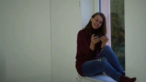 Woman on the window upset. Video stock 142132673