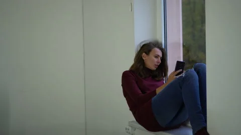 Woman on the window upset. Stock Footage 142135260