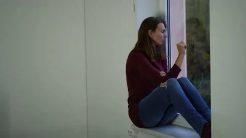 Woman on the window upset. Stock Footage 142137136