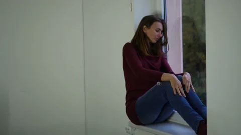 Woman on the window upset. Stock Footage 142138118