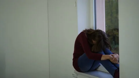 Woman on the window upset. Stock Footage 142138531
