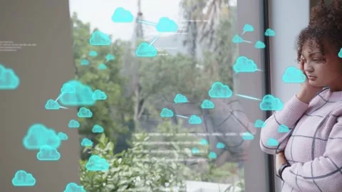 Woman at window watching animated cloud icons appearing and overlaying Stock Footage 333873172