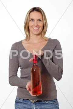 Woman with wine bottle Stock Photos