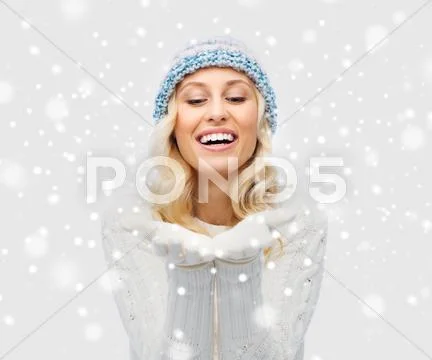 Woman in winter heat showing empty palms Stock Photos