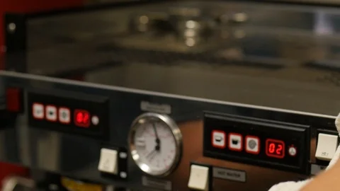 Woman wipes down cappuccino machine with cloth Stock Footage 93379953