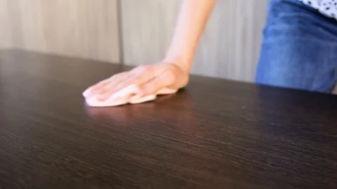 Woman wipes the dust off the table Stock Footage