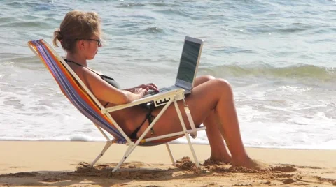 Woman with Wireless Laptop Computer on Beach Stock Footage 1053267