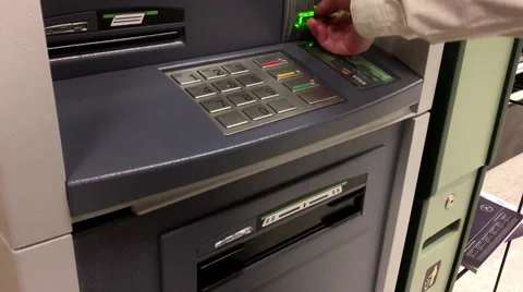 Woman withdraw cash from ATM machine inside TD Bank Stock Footage 68960367