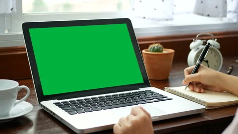 Woman work with laptop computer, use finger with keyboard , writing on notebook Stock Footage 166943976