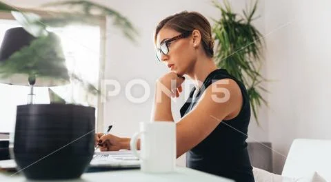 Woman at work in office Stock Photos