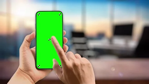 Woman in work office using smartphone with green mock up screen swip and scroll Vídeo Stock 306171902